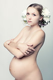 Nude pregnant woman.