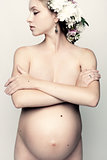 Nude pregnant woman.