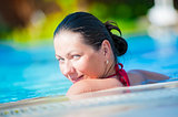 Portrait of happy girl in pool