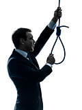 man holding adjusting hangman noose silhouette