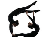 two women contortionist  exercising gymnastic yoga silhouette