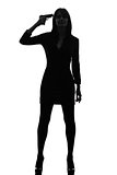 sexy detective  woman holding aiming  gun silhouette