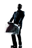 silhouette man full length fired carrying heavy box