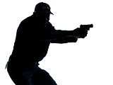 Policeman aiming a handgun