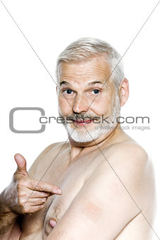 Senior man portrait showing nicotine patch