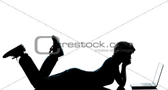 one young teenager boy  girl silhouette computer computing lapto