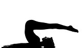 woman halasana Shoulder Stand yoga pose 