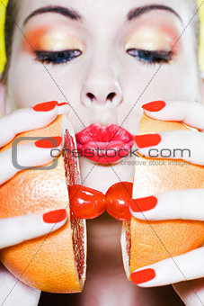 Woman Portrait Making grapefruit kiss