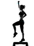 woman exercising step aerobics 