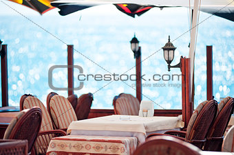 Table in a restaurant by the sea.
