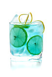 Blue alcohol cocktail with lemon slices