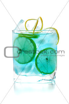 Blue alcohol cocktail with lemon slices