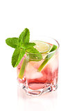 Pink alcohol cocktail with lime slices and mint
