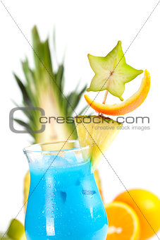 Blue Hawaii tropical cocktail with pineapple on background