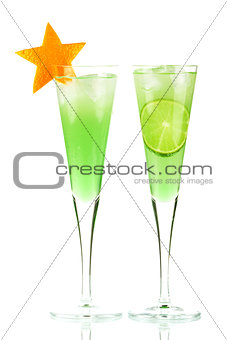 Mint Champagne alcohol cocktail with orange star and lime slice
