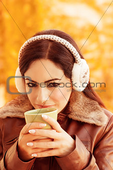Cute girl enjoying tea