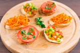 Delicious bruschetta with vegetables and herbs