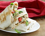 burrito (doner) with chicken and vegetables wrapped in pita bread