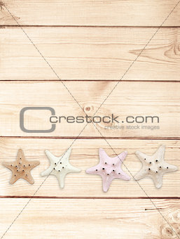 Starfishes on wood texture