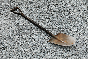 Shovel on gray gravel