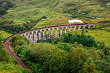 View of a steam train on a famous Glenfinnan viaduct, Scotland
