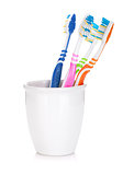 Four colorful toothbrushes