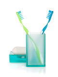Two toothbrushes and soap