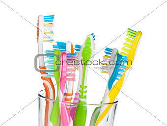 Colorful toothbrushes in glass
