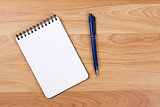 Blank notepad with pen