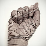 man hand tied with wire