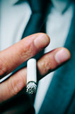 man in suit smoking