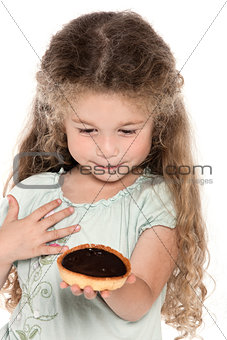 Little girl portrait showing chocolate pie