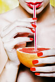 woman drinking grapefruit juice