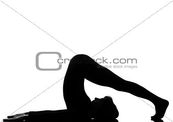 woman halasana Shoulder Stand yoga pose 