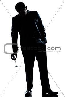 man drunk holding a glass of red  wine