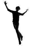 young man silhouette jumping happy