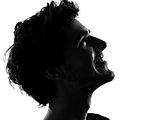 young man silhouettes miling happy