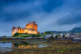 View of Eilean Donan castle at sunset in Scottish highlands