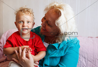 Happy grandmother with her little grandson.