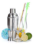 Cocktail shaker, glasses, utensils and citruses