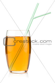 Apple juice in a glass with drinking straws