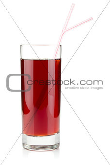 Pomegranate juice in a glass with two drinking straws
