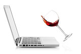 Wine falling on laptop