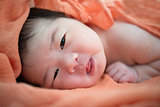 Newborn Asian baby girl awake