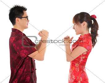 Chinese cheongsam people respecting to each other