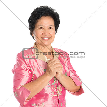 Oriental senior woman greeting