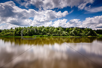 Stripe of Forest Between Cloudy Sky and the River near Moscow, V