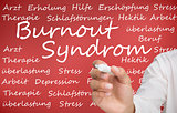 Hand writing different german words about burnout syndrome