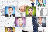 Businessman pointing at digital interface presenting profile pictures