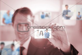 Smiling businessman picking a picture